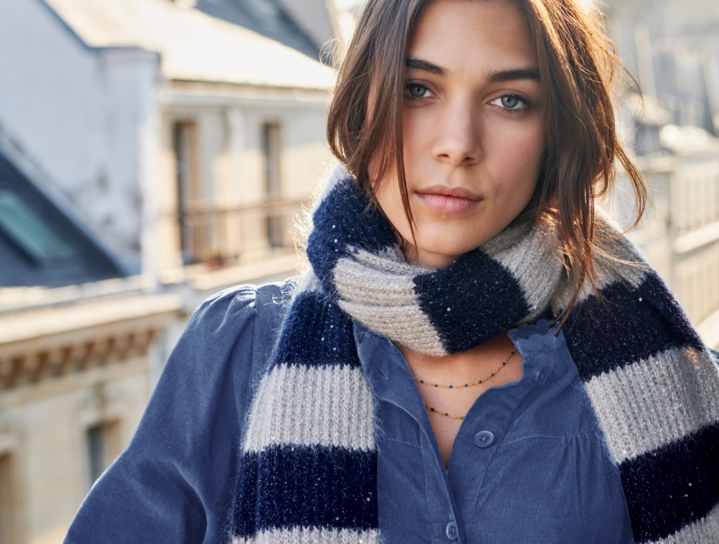 Woman wearing stripey WYSE London scarf